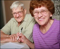 Couple signing papers photo